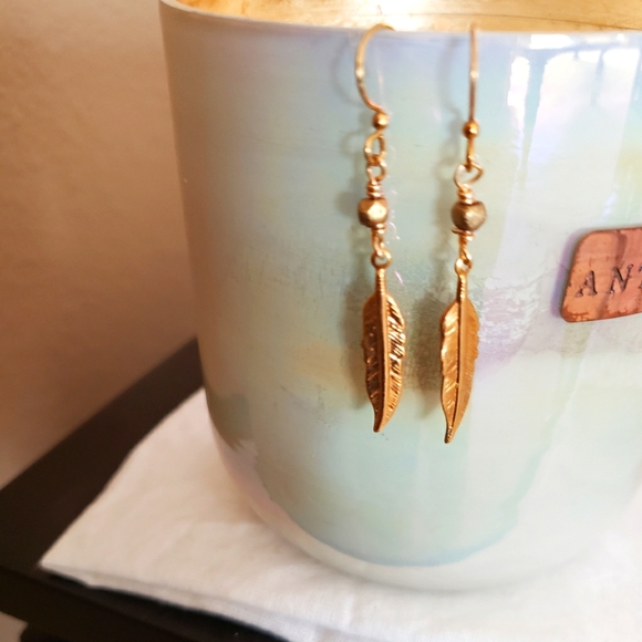 Gold feather earring on fishook - Picture 3 of 5